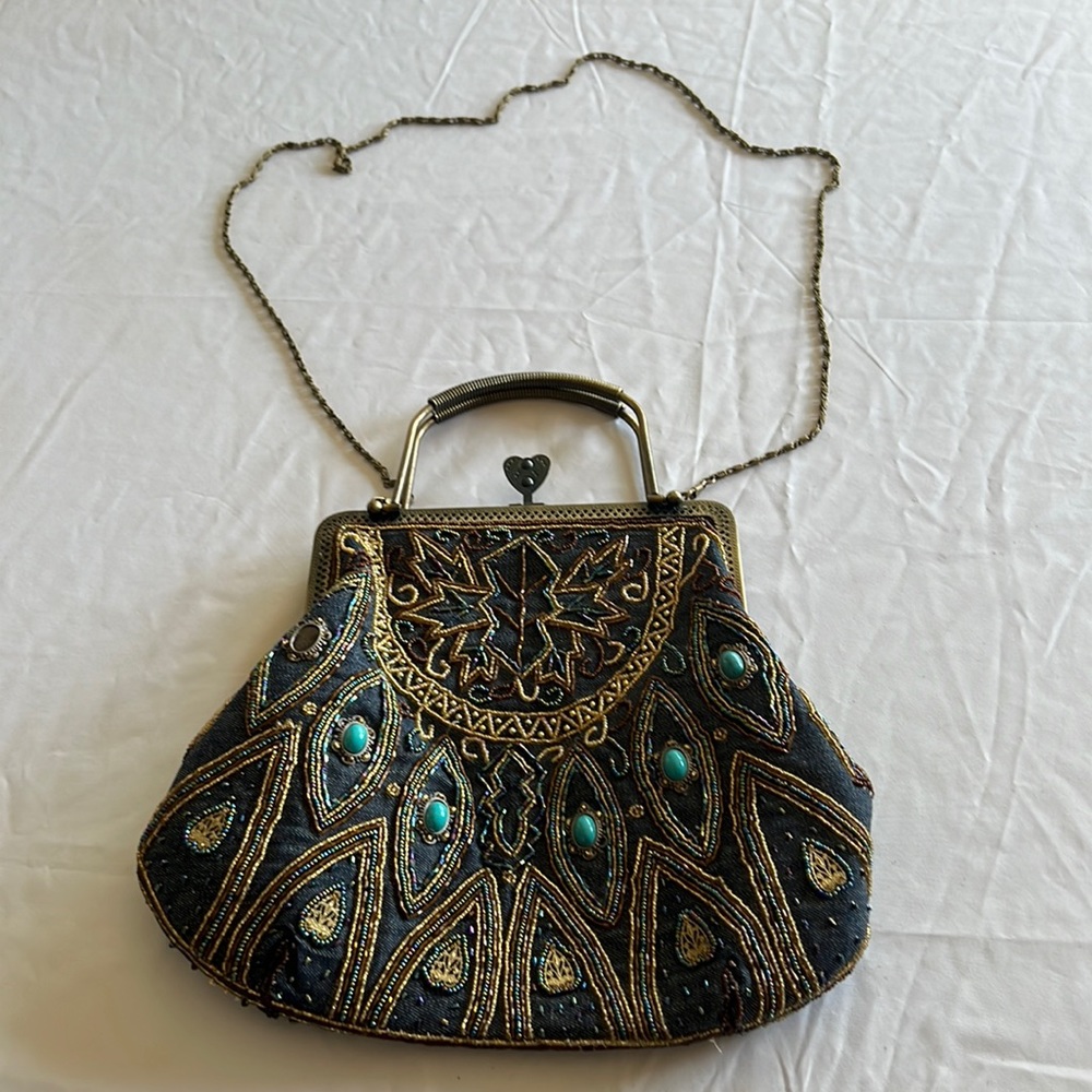 Handmade handbag;chain straps;metal clasp; great condition;one stone is missing
